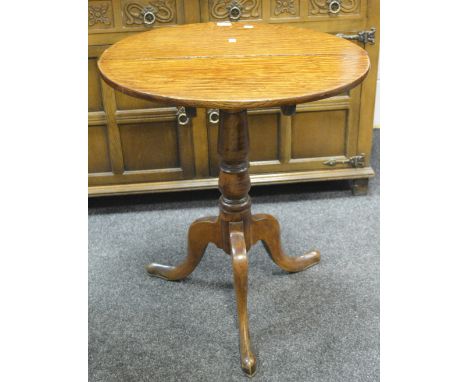 A circular oak tilt top table, turned support, tripod base (1)