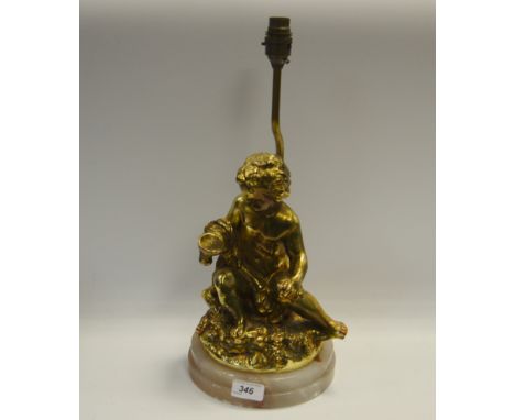 A 20th Century gilded figural lamp, onyx base.
