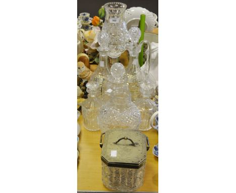 A Waterford crystal ewer and decanter; a similar table tamp; other decanters; and EPNS mounted biscuit barrel, dated 1883; a 