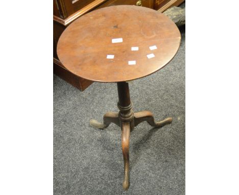 A George III mahogany tripod table, circular top, canon barrel column, cabriole supports, pad feet, circa 1780.
