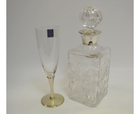 A glass decanter fixed with a silver collar, hallmarked Birmingham; a silver based Dartington crystal champagne flute, hallma