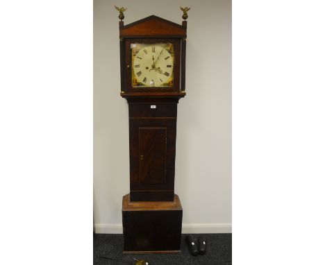 A George III mahogany longcase, architectural pediment, later eagle on ball finials, painted dial, Roman numerals, subsidiary