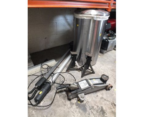 A CAR JACK WITH TWO SMALL STANDS TOGETHER WITH A BONNET LIGHT AND LAUNDRY BIN