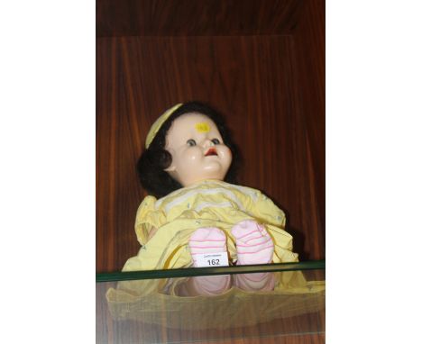 A VINTAGE ROLLER EYE DOLL