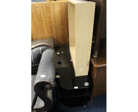 A BLACK GLASS TV TABLE TOGETHER WITH A SMALL BOOK SHELF