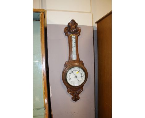 AN OAK ANEROID BAROMETER  A/F