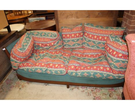 A PAIR OF RETRO ERCOL THREE SEATER SOFAS