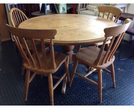 Circular Pine Dining Table with 3x matching Stick Back Chairs and One other 