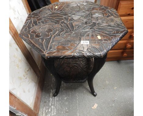 Profusely Carved Oak Occasional Table with Shelf under 