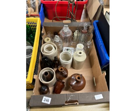 Selection of vintage glass chemist bottles and stoneware 