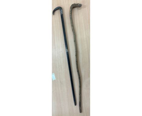 Two vintage walking sticks, one silver rim