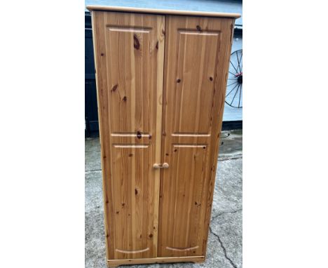 2 Door pine robe with shelf, hanging rail, approximate measurements: Height 70 inches Width 32 inches,  Depth 20.5 inches