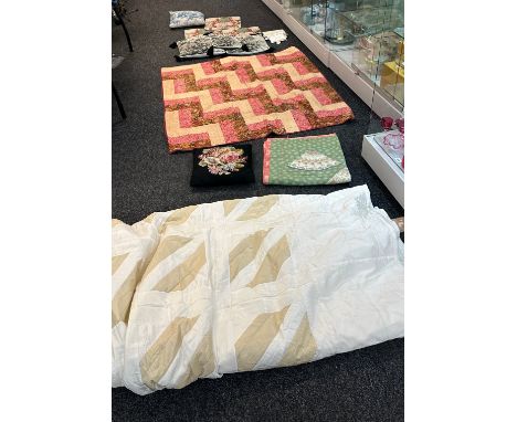Selection of throws and cushions some new also to include a cream silk vintage bed quilt 