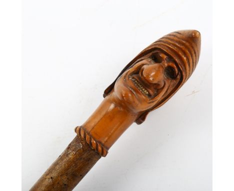 An 18th/19th century fruitwood Mrs Punch design walking stick, handle length 13cm, overall length 104cm 