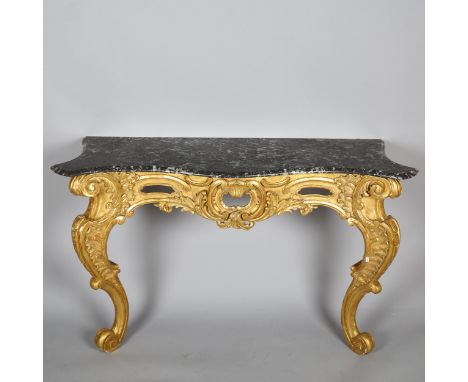 A 19th century French Rococo style console table, carved and scrolled giltwood frame with original moulded and shaped marble 