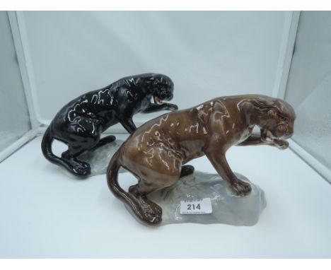 Two Beswick studies, Puma On Rock, both style two, black and tawn 1823