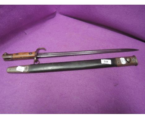 A British SMLE bayonet, pattern 1907 by Wilkinson, marked 2MD31170, with scabbardCONDITION REPORT - MAKERS STAMP IS WILKINSON