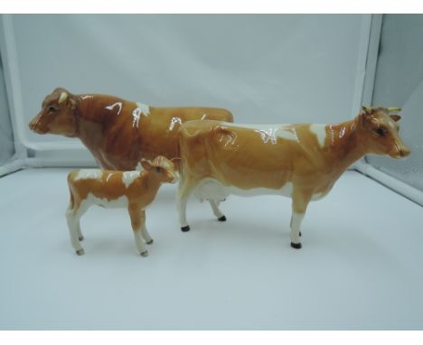 Three Beswick studies, Guernsey Family, Bull 1451, Cow, ears separate 1248A &amp; calf 1249A