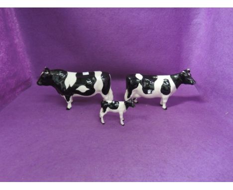 Three Beswick studies, Friesian Bull (af), Cow 1362A and Calf 1249C