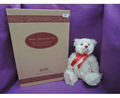 A modern Steiff Bear, Ours Teddy Bear, Tricolore, 1997/1998 having white tag 657986 with gold button, certificate, box, and o