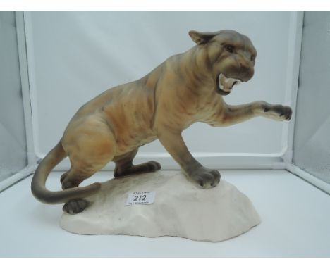 A Beswick study, Puma On Rock, style one, tan, matt 1702