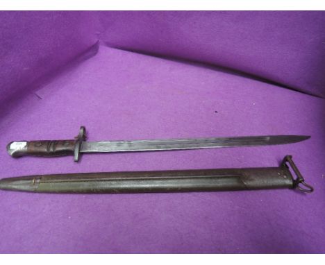 An American bayonet for Enfield rifle, model 1917 by Remington, with metal and leather scabbard