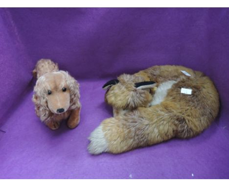Two modern steiff animals, Waldili Dachshund having yellow tag 1322 02 and Curled Fox having yellow tag 1542/35