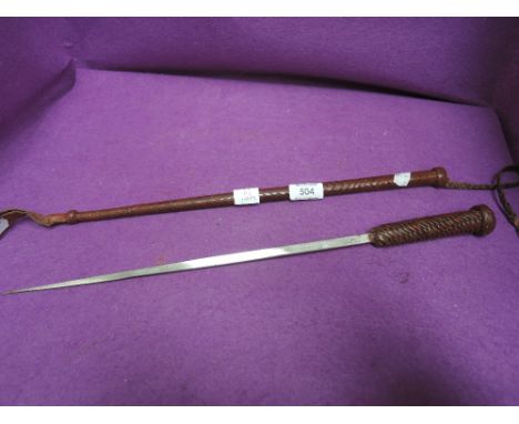 An early 20th century leather bound riding crop/dagger stick with triangular steel blade, numbered 5