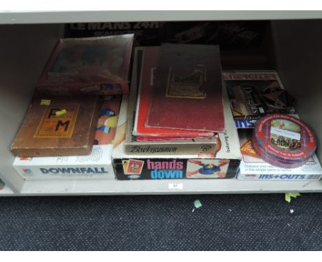 A shelf of vintage games including DownFall, Hands Down, P&amp;M, Sorry etc