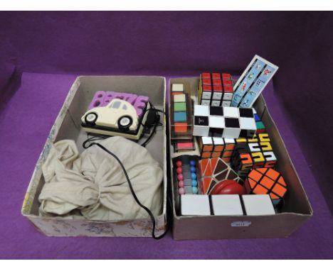 Two small boxes of vintage childrens puzzles including Rubik's Cubes, Magic Snake and Lumar YoYo along with a selection of ma
