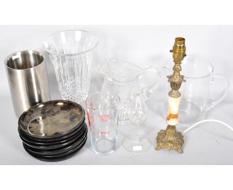 A gilt metal and alabaster lamp, together with a group of glass vases, jugs, a measure and stands