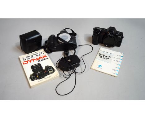 Two Minolta cameras, with instruction books, and a cased Weston Master light meter