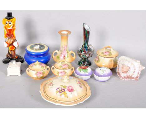 A collection of assorted ceramic items to include; lidded pots, part vanity set, Murano clown and other items. 