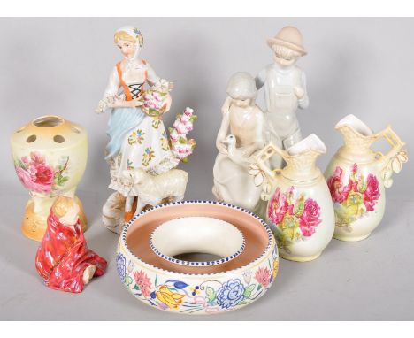 A collection of assorted ceramics and figures to include poole pottery and other items. 
