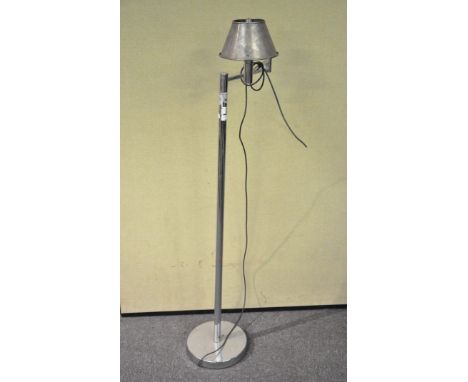 A chrome standard lamp