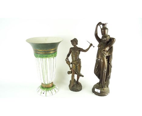 A vase light and two figures