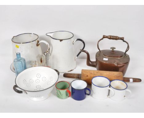 A collection of kitchen wares, to include enamel jugs and a copper kettle
