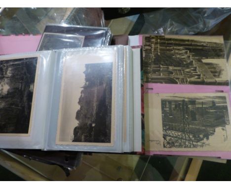 Two albums of mixed vintage postcards