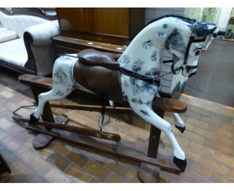 Vintage rocking horse on wooden frame