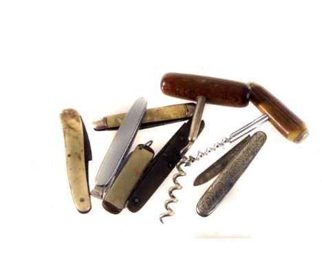 An assortment of vintage penknives and corkscrews, including a silver penknife, various other designs and ages (parcel)