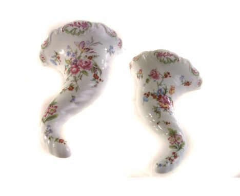 A pair of Royal Worcester cornucopia porcelain wall sconces, by Compton & Woodhouse, each with floral and swag decoration, to