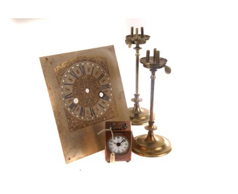 A collection of clock and watch parts and spares, including dials, keys and hand tools, plus a selection of candlesticks (par