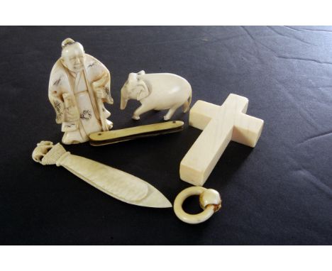 A Tokyo School ivory netsuke figure, together with an ivory cross, ivory bookmark and two other ivory items (parcel)