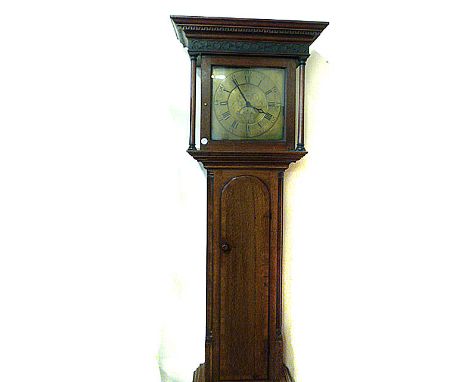 An oak long case clock, with lantern 30 hour movement, brass face, two train, in later case