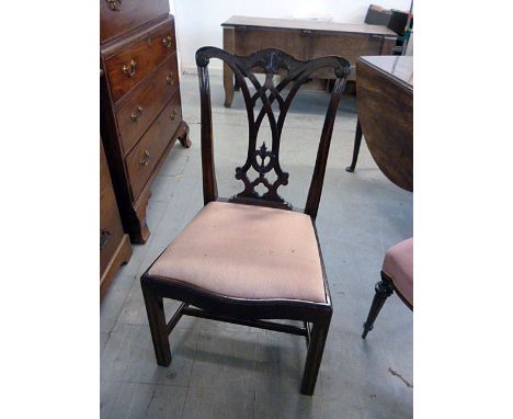 A Chippendale style single chair, with carved swag design to back, with lower stretcher