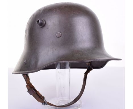 WW1 Imperial German Steel Combat Helmet, retaining much of the original field green paint finish to the exterior and interior