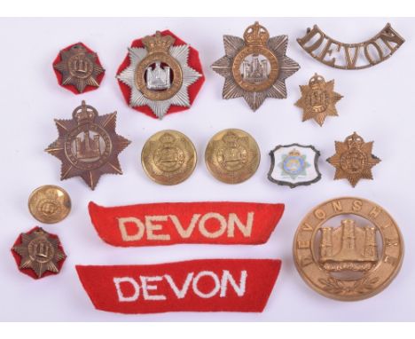 Badges and Insignia of the Devonshire Regiment, consisting of gilt brass other ranks helmet plate centre, Victorian other ran