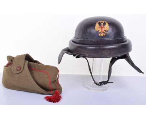 Spanish Tank Drivers Helmet, being a black leather covered hard shell helmet with gilt metal badge to the front (one pin miss