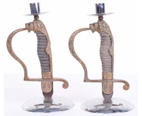 Pair of Candlesticks Made From German Army Officers Dagger Hilts, lion head jewelled eye dagger hilts with down swept eagle a