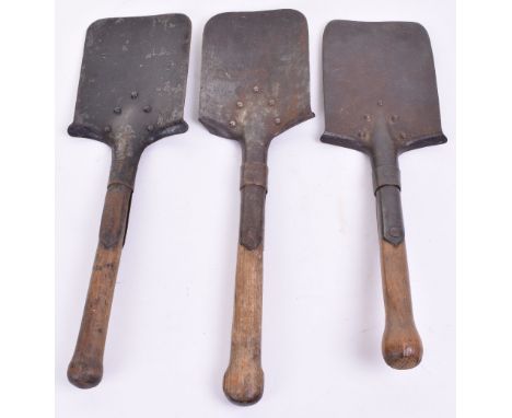 Three Imperial German Entrenching Tools, all complete with the original wooden shaft handles. Various conditions to the spade